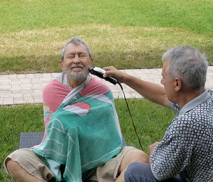 man trimming a other mans beard man trimming a other mans beard