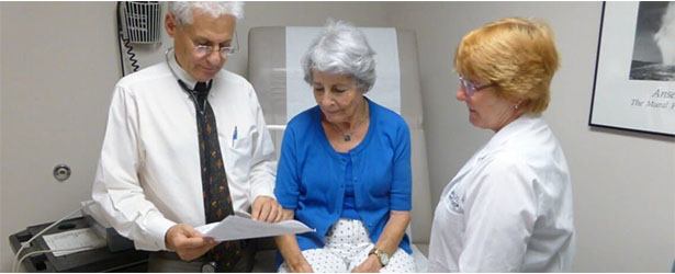 doctors consulting a patient
